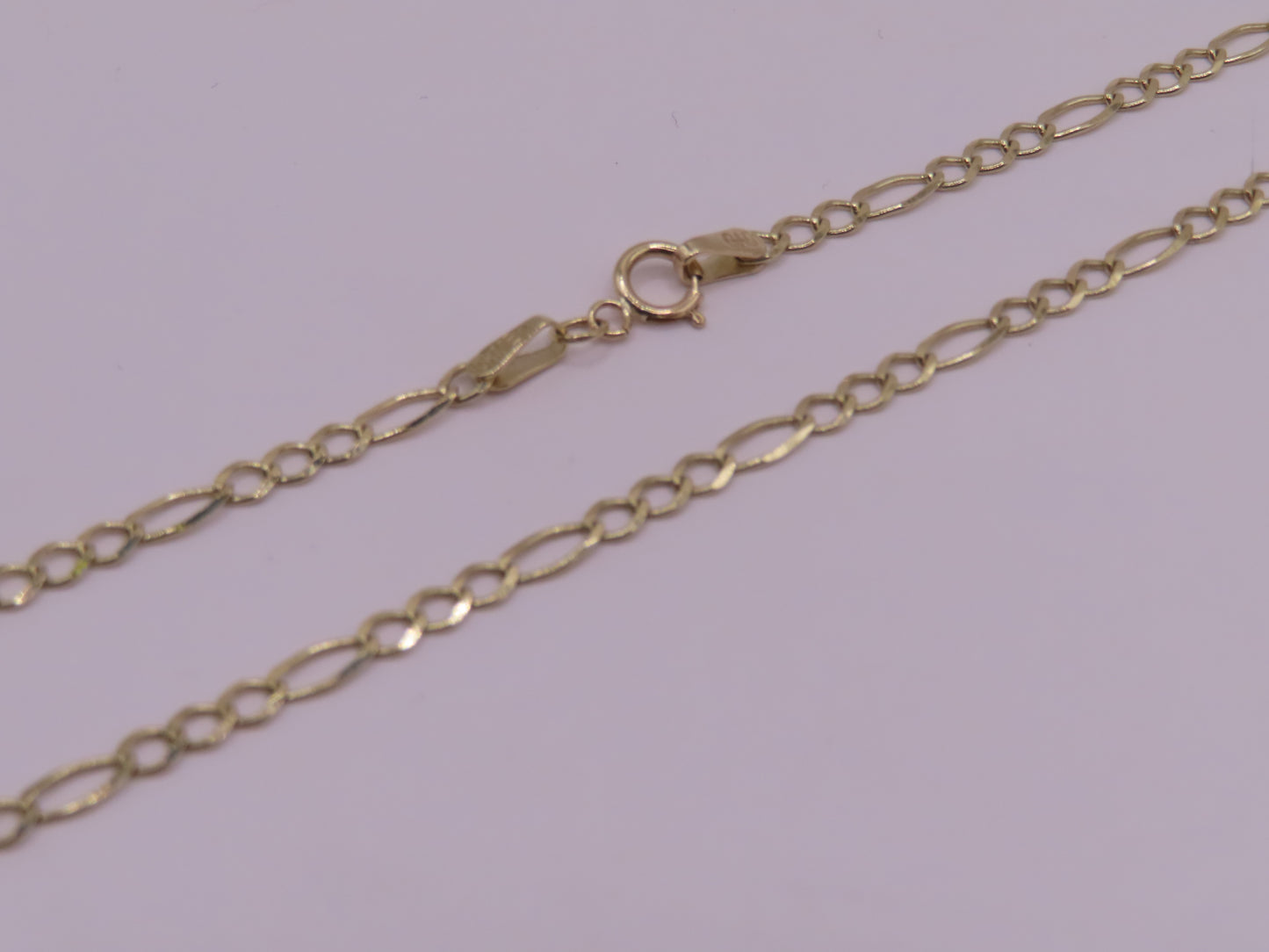 10k gold figaro chain 22in/4mm