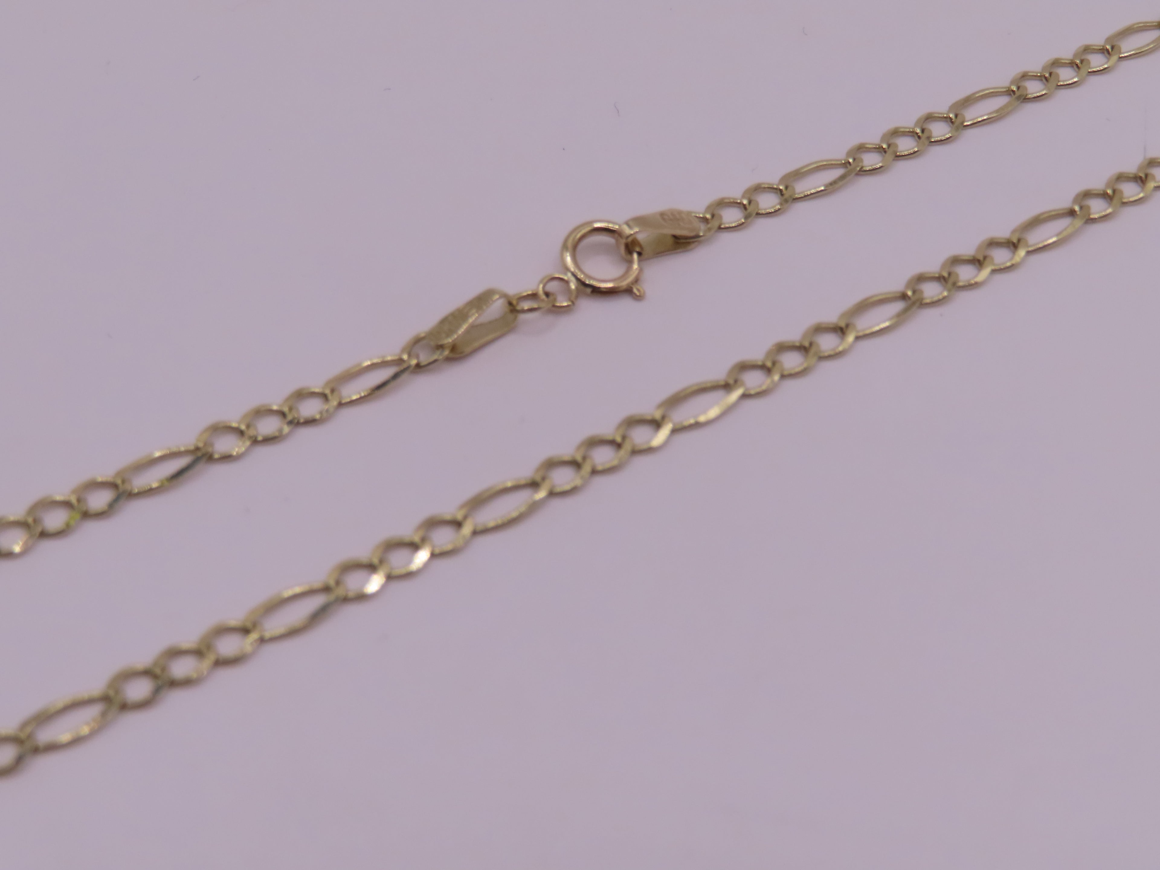 10k gold figaro chain 22in/4mm