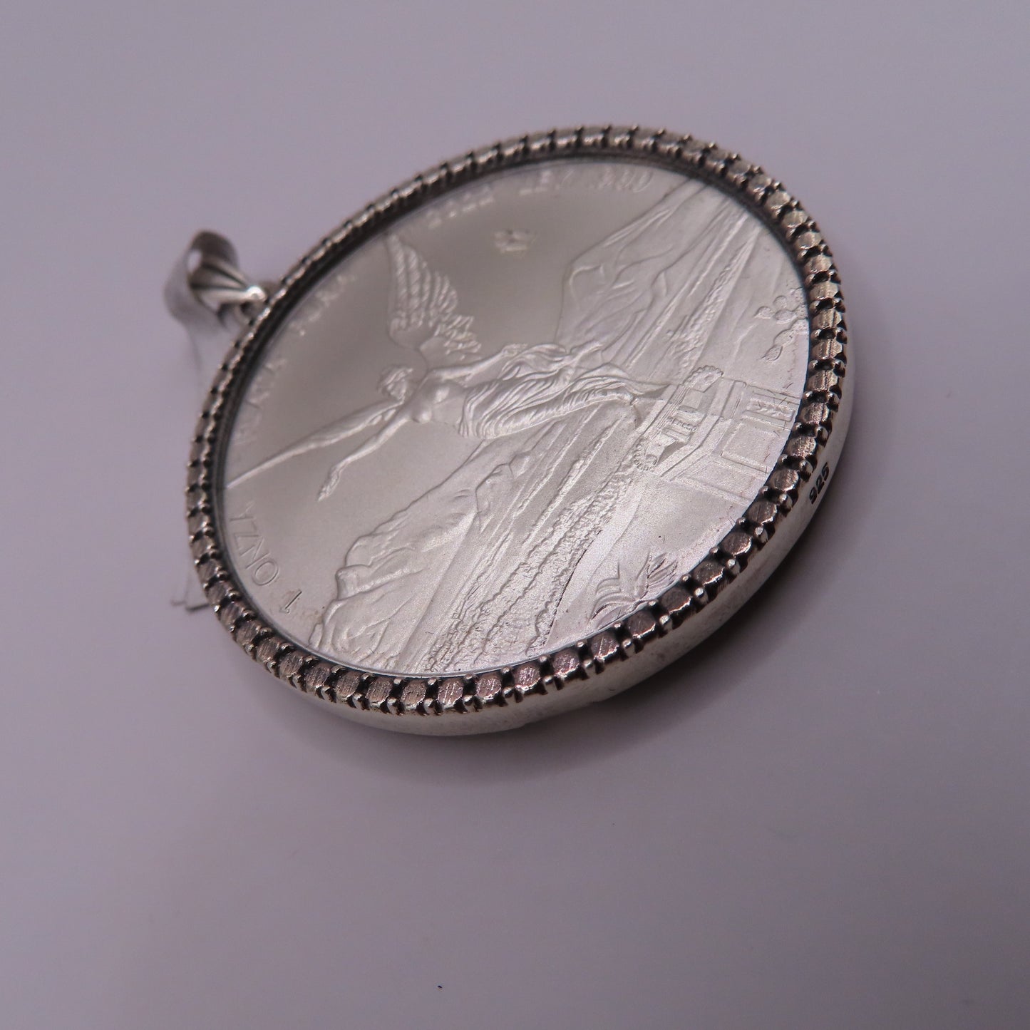 999 silver Centenario 1oz w/925 silver bezel